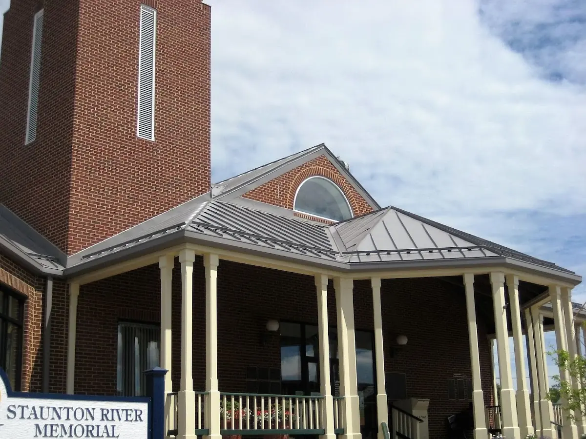 Skilled roofing craftsmen working on a residential roof in Kentland